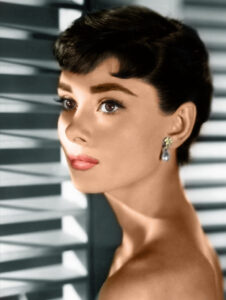 Audrey Hepburn in a classic portrait showcasing her timeless elegance and iconic style, highlighting her sophisticated beauty and graceful demeanor.